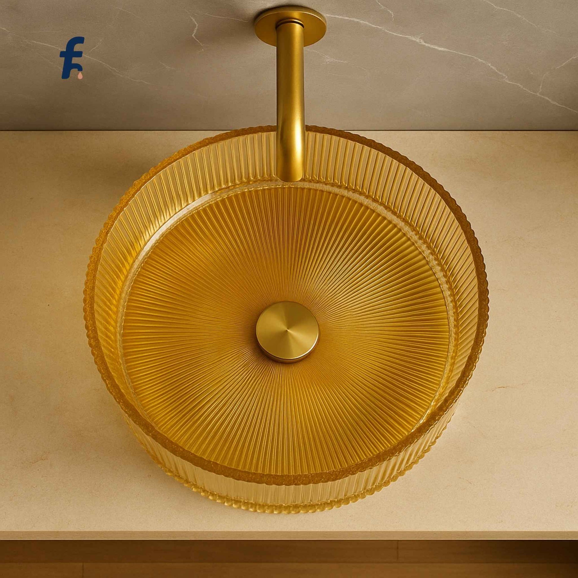 Gold glass fluting sink on a beige countertop with a marble wall background for modern indian homes