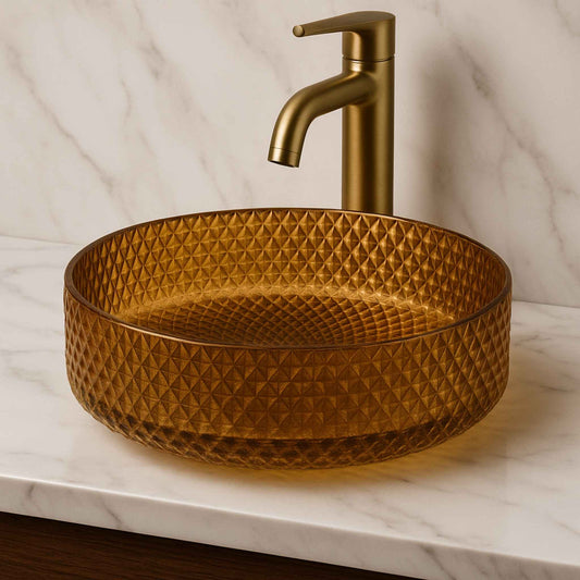 Front view of golden textured round glass wash basin placed on a luxurious vanity