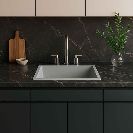 Front view of grey granite kitchen sink installed in luxury kitchen with Italian marble countertop