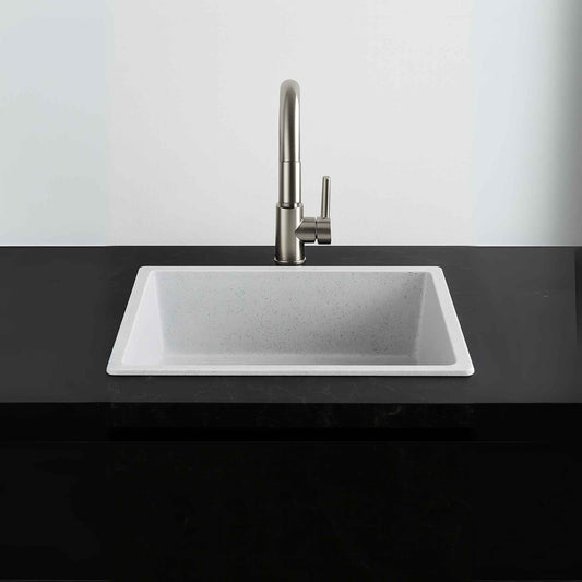 Front view of white speckled granite sink placed in luxury kitchen with beige Italian marble