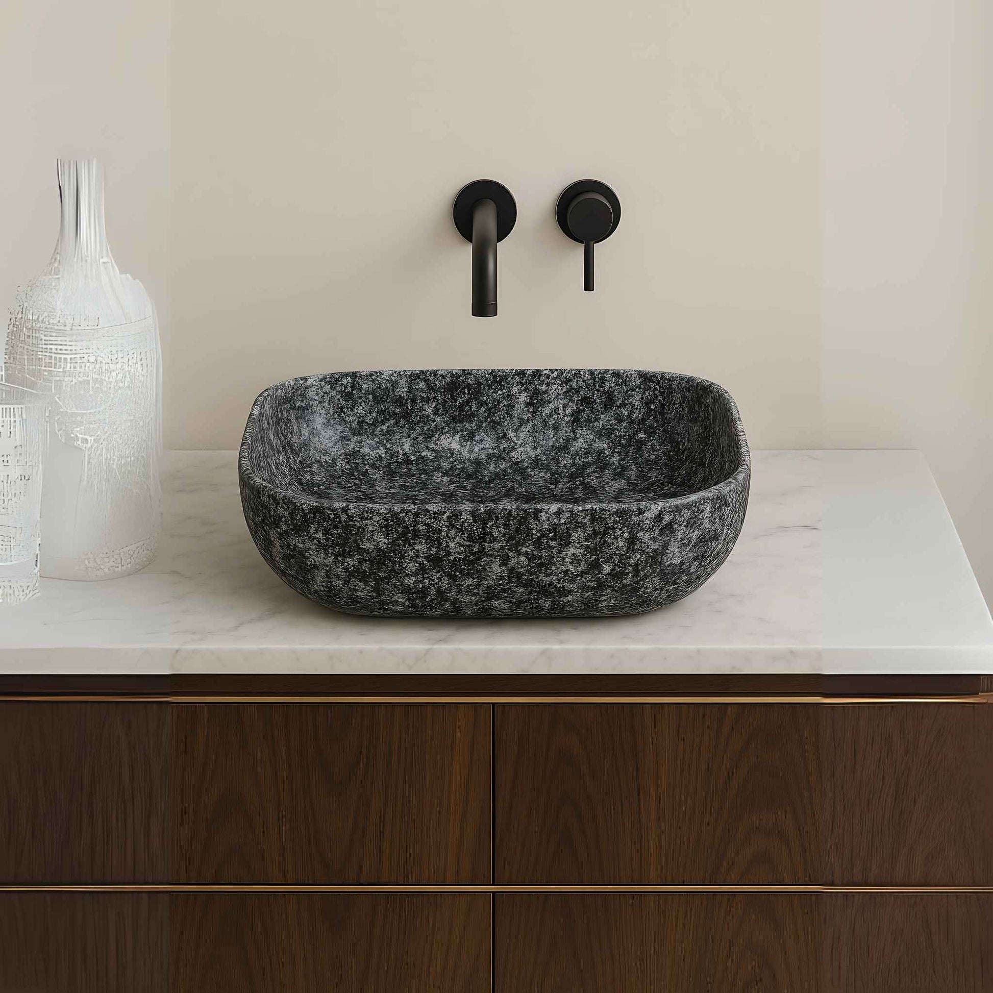 Front view of grey granite rectangular wash basin with matte black wall-mounted faucet
