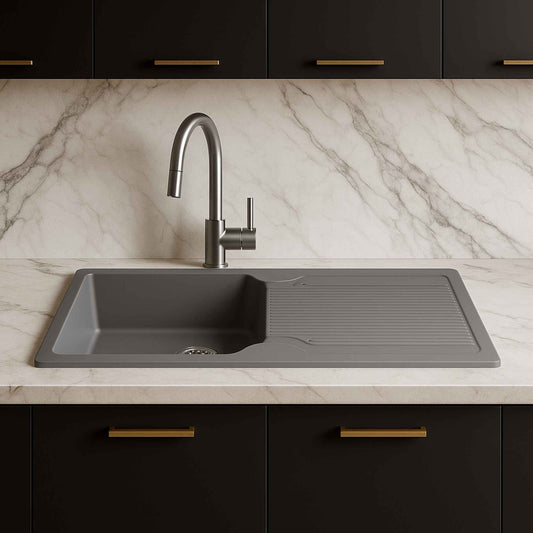Front view of grey granite kitchen sink in a luxurious satvario marble kitchen setup