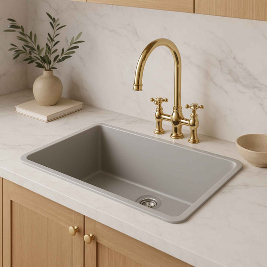 Side angle view of grey granite sink with premium tap