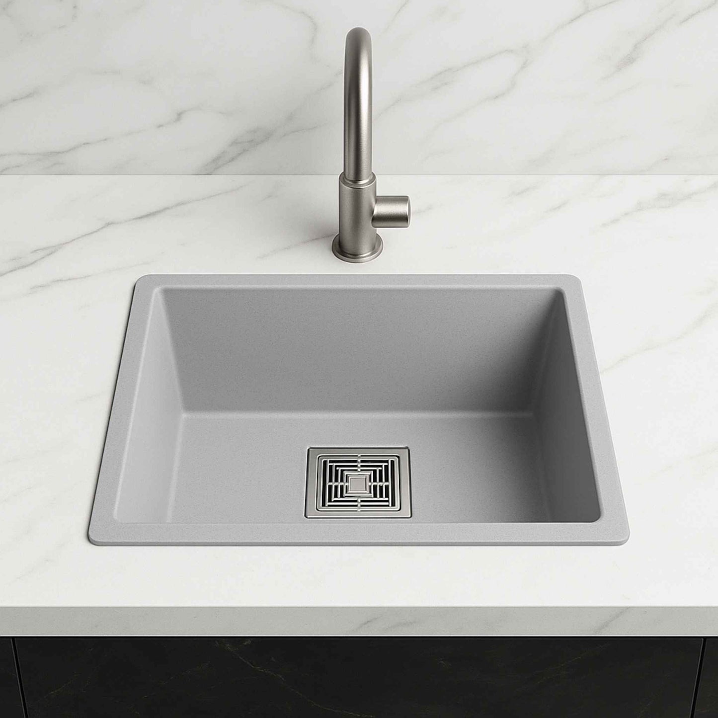Front view of grey metallic kitchen sink 18x24x9 inches installed in a luxurious white marble kitchen