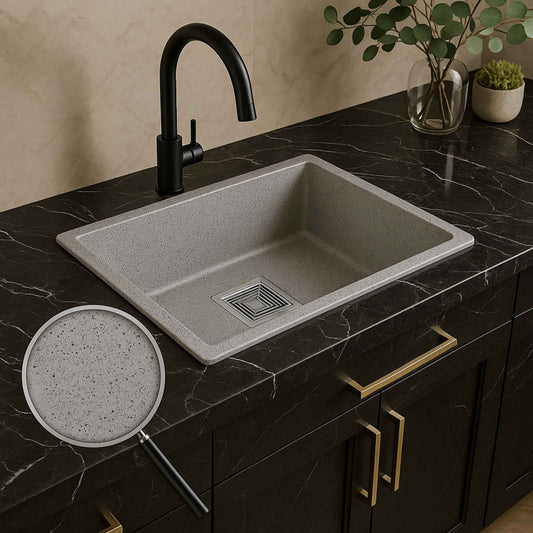 Grey 18x16 kitchen sink installed in luxurious modern kitchen with white quartz top
