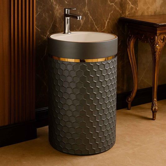 Freestanding grey honeycomb washbasin installed in a luxurious bathroom with marble and wood accents