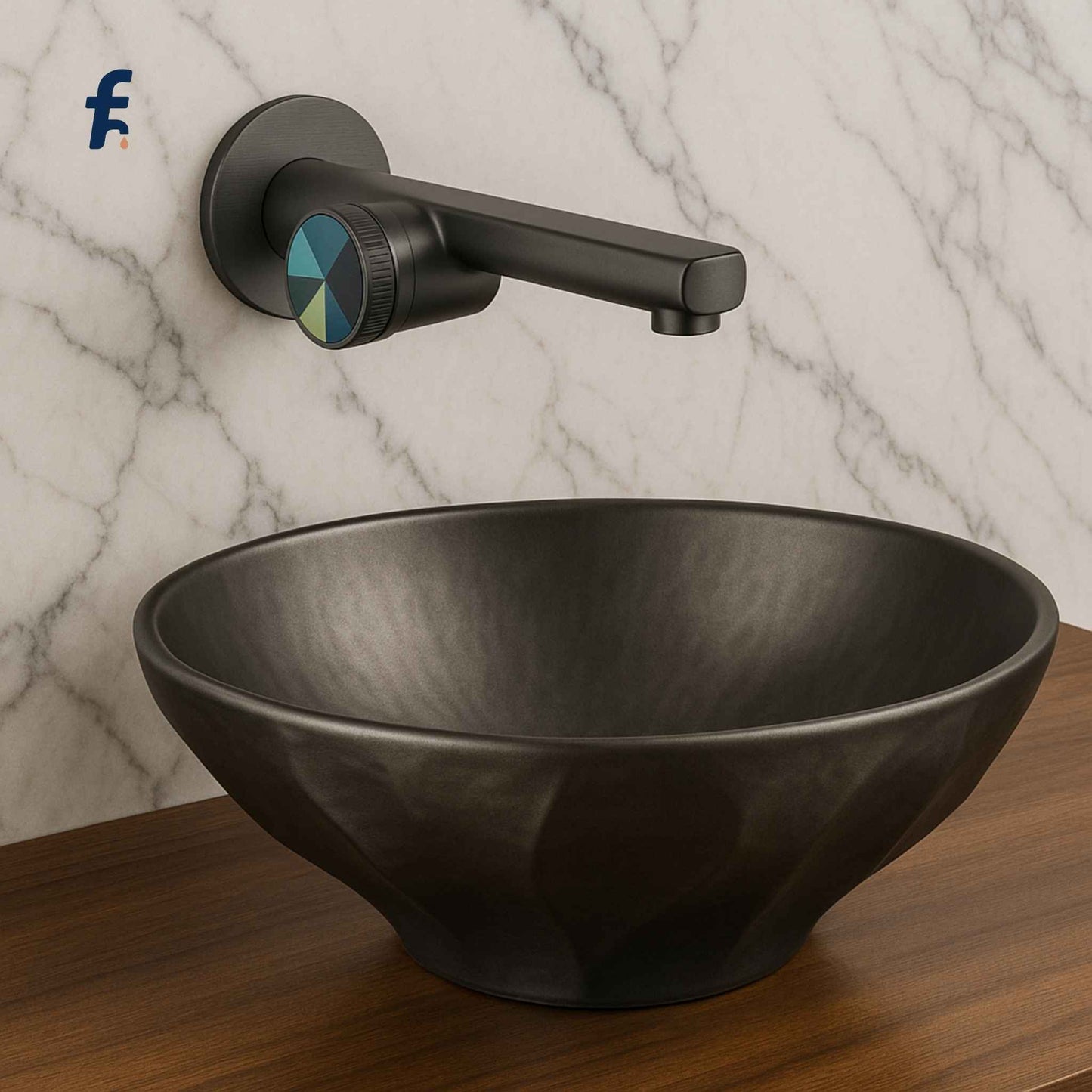 Black sink and faucet set against a marble wall