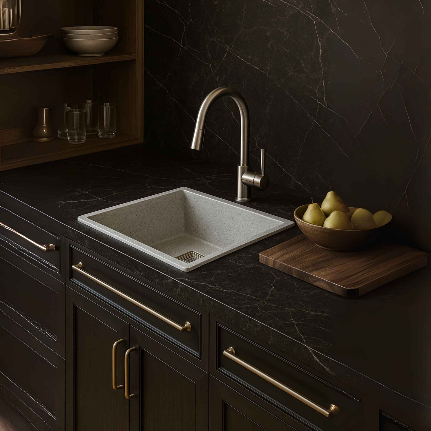 Full modular kitchen setup with light grey granite sink and dark Italian marble
