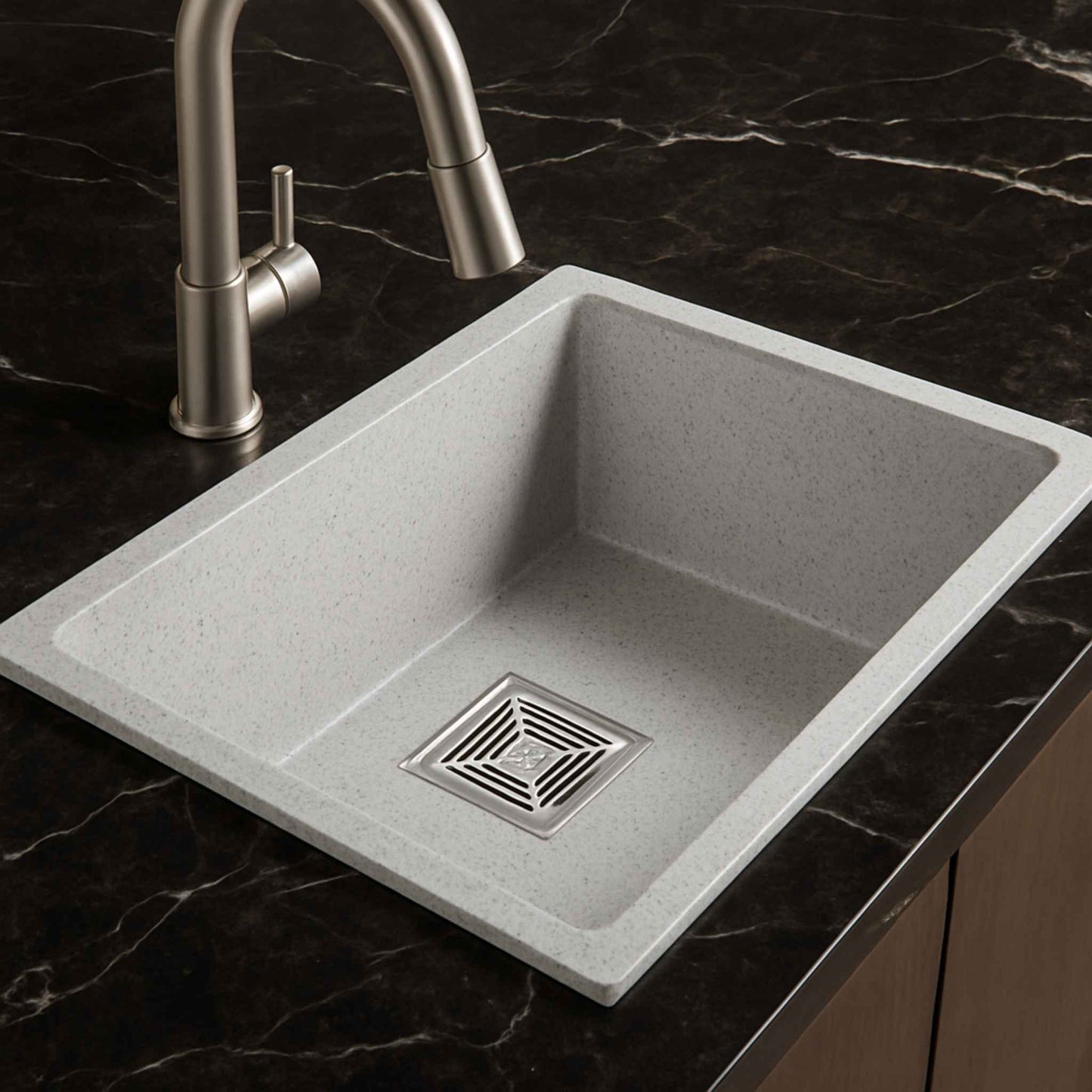 Side angle image of light grey granite sink with luxurious Italian marble countertop