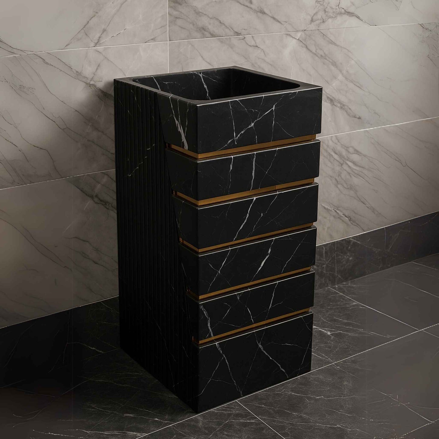 Black designer washbasin placed in luxury setting with dark marble tiles and gold fittings