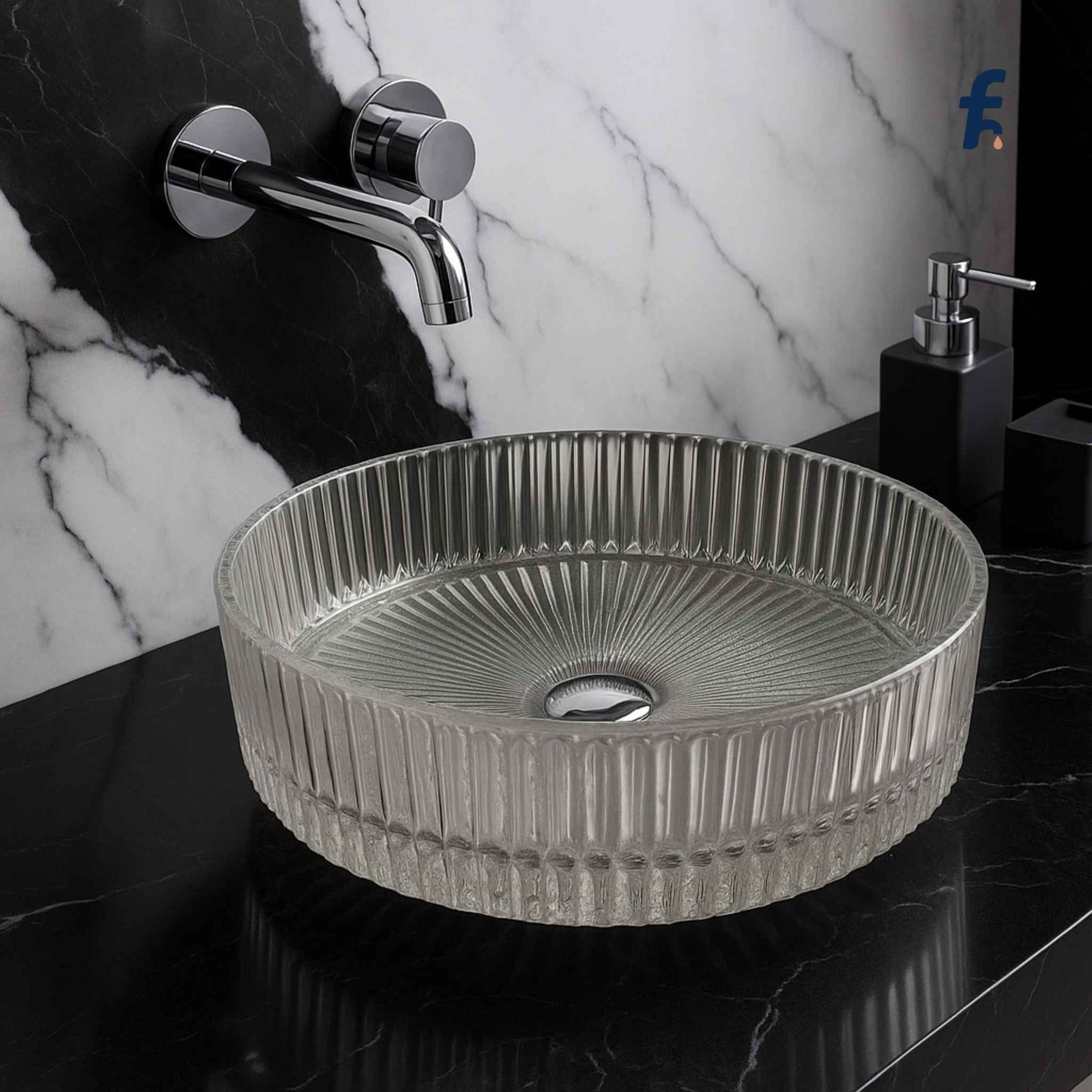 Round textured sink on a black countertop with a marble wall background, Luxury glass washbasin with round fluted design – front view in modern bathroom.
