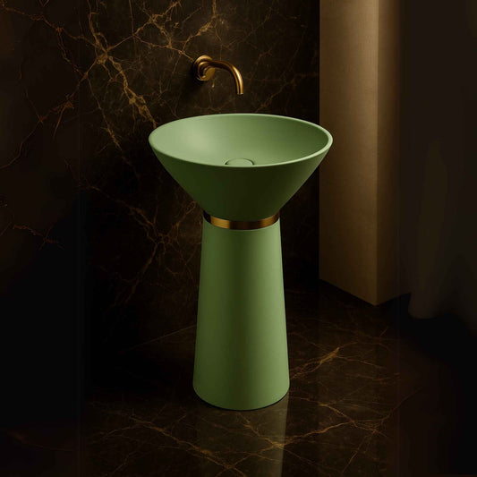 Luxury matte green pedestal washbasin with gold ring in a marble bathroom 