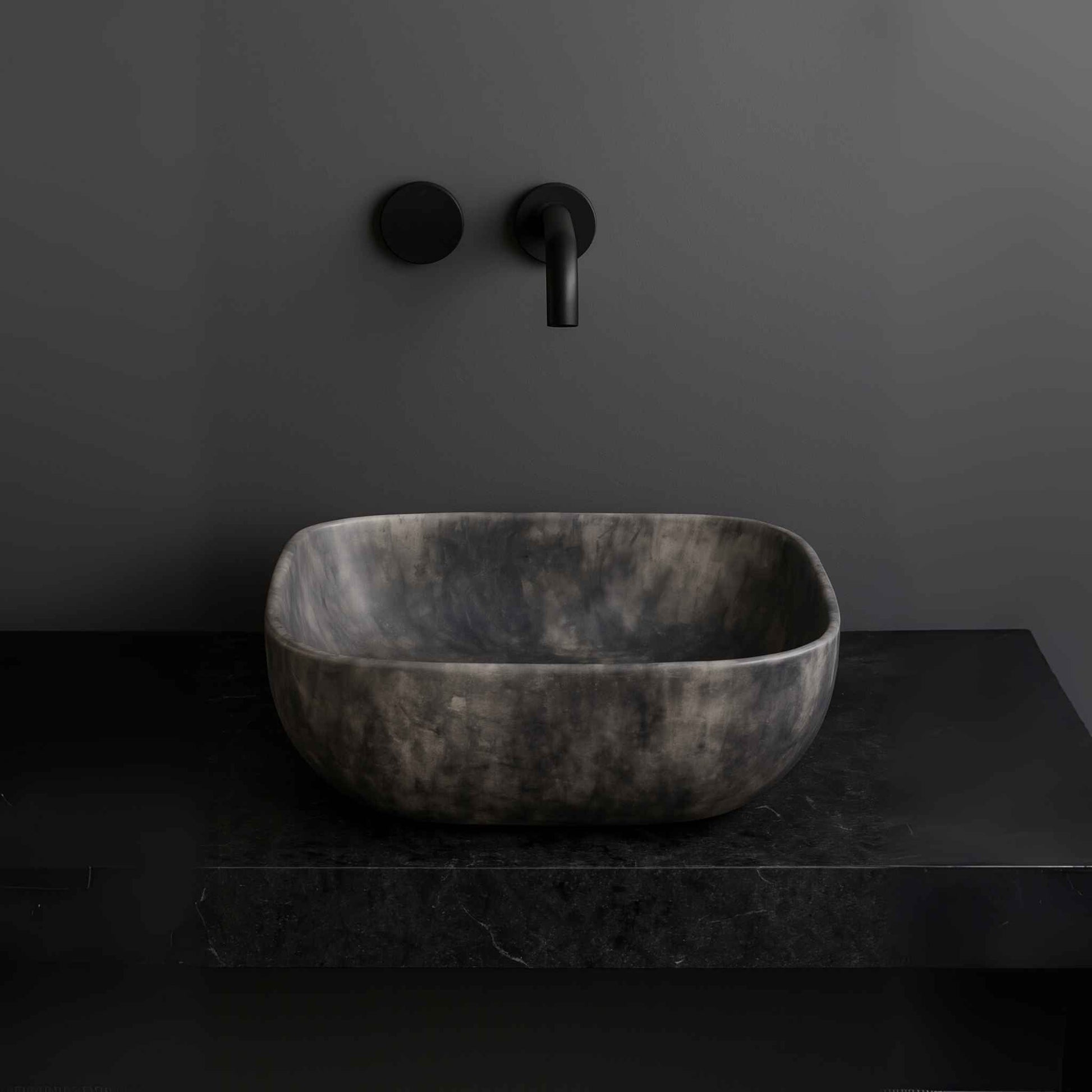 matte black marble finish rectangular wash basin placed on modern vanity