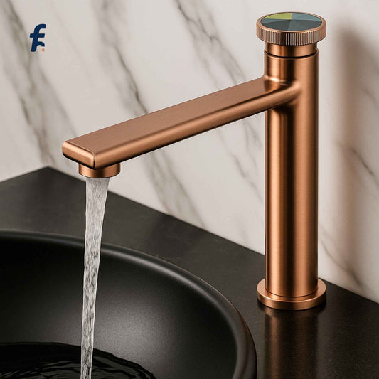 Bronze faucet with water flowing into a sink against a marble background, Designer rose gold faucet with black basin