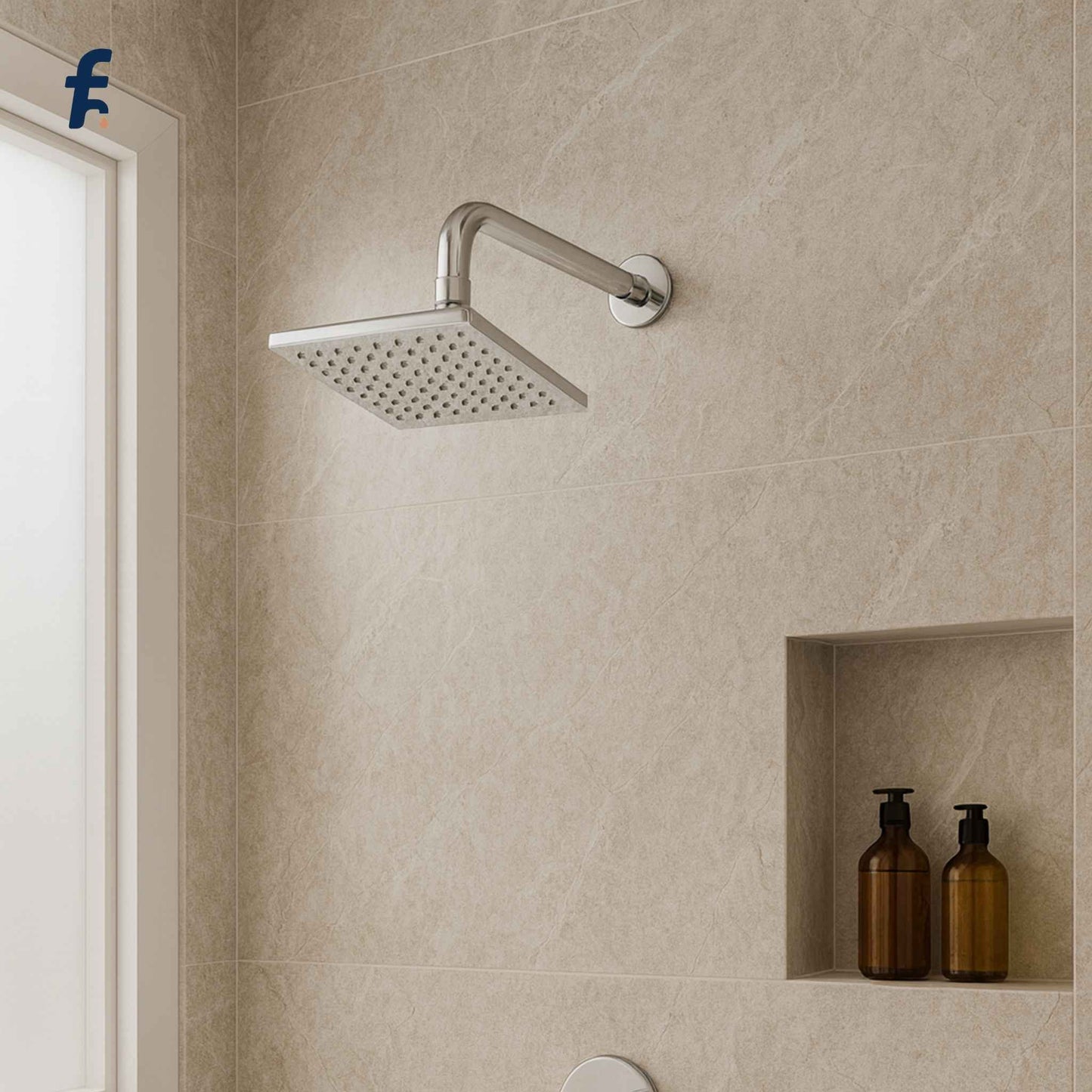 Chrome shower head mounted on a tiled wall with two brown bottles in a niche below.