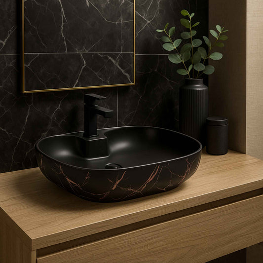 Front angle view of matte black ceramic wash basin with copper marble pattern and integrated faucet mount