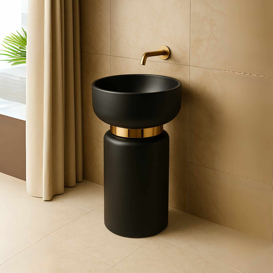 Matte black pedestal washbasin placed in a premium modern bathroom with rich textures