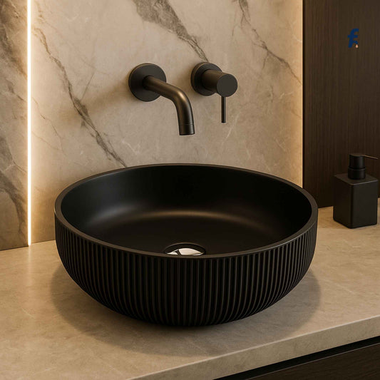 Front view of matte black ribbed glass wash basin on luxury marble vanity