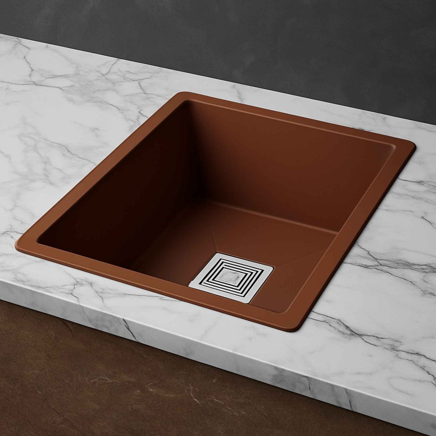 Side angle of metallic brown kitchen sink on premium marble countertop