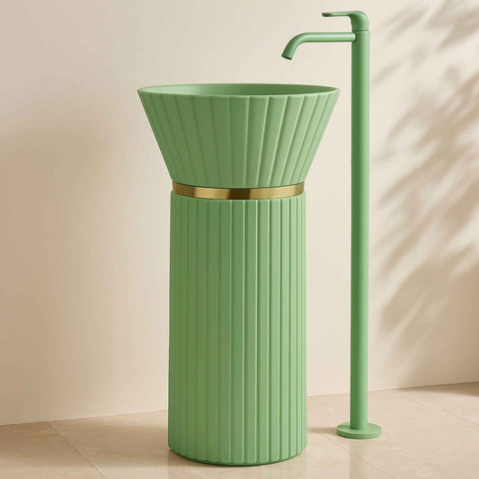 Side angle of freestanding mint green basin with gold band and faucet