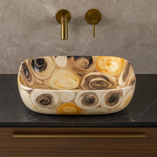 Front view of rectangular multicolour swirl ceramic wash basin on black marble vanity