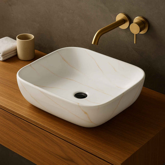 Side angle of premium white ceramic wash basin with marble gold veining design