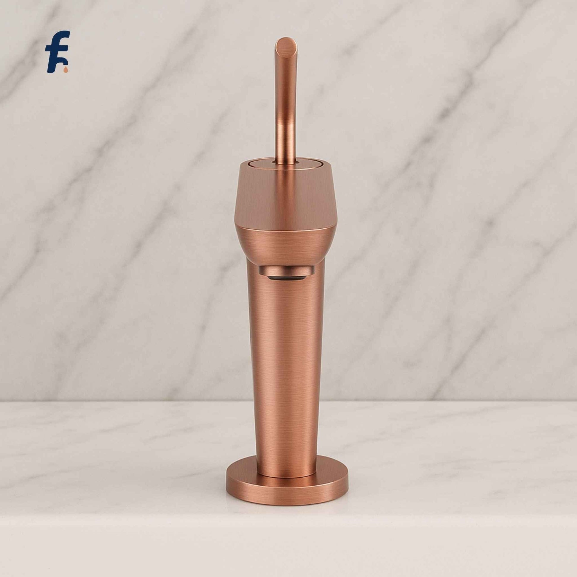 Copper faucet on a marble background, Side angle of brushed rose gold faucet with water flowing into basin
