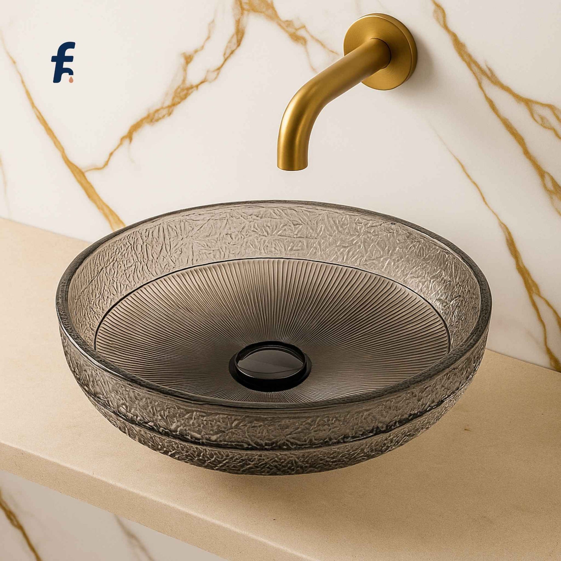 Close-up side view of round black crystal bathroom basin with gold faucet