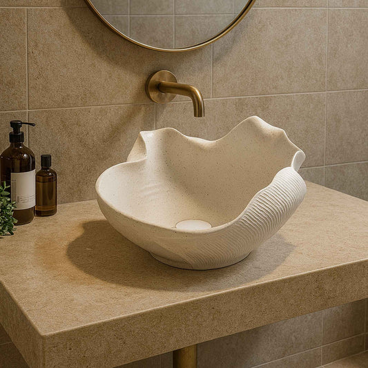 Front view of shell-shaped white designer washbasin in luxurious bathroom