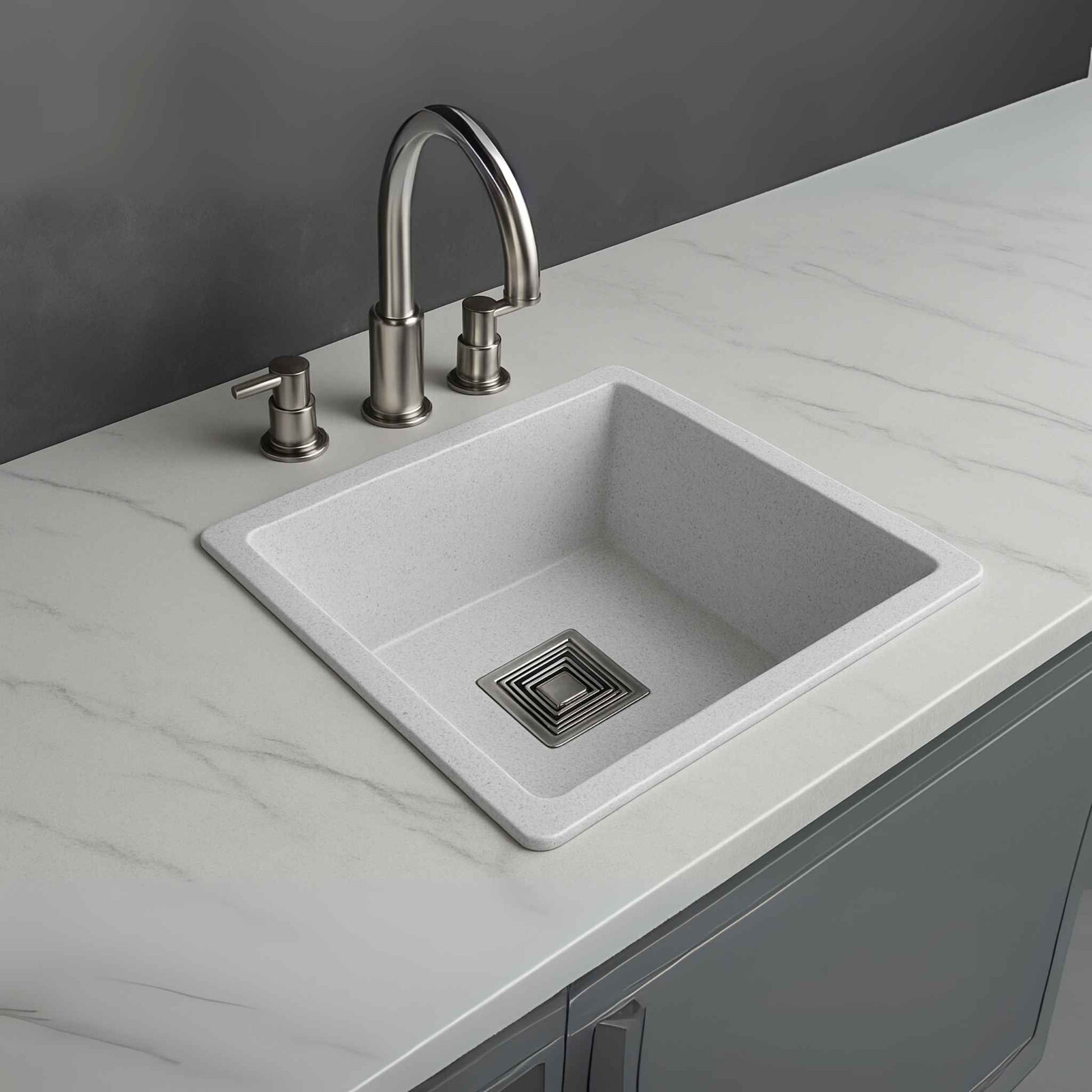 Side angle of white granite kitchen sink with sleek countertop marble design