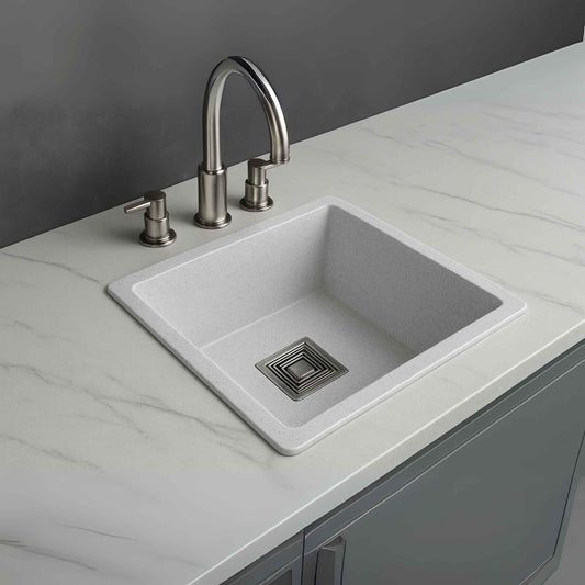 Side angle of white granite kitchen sink with sleek countertop marble design