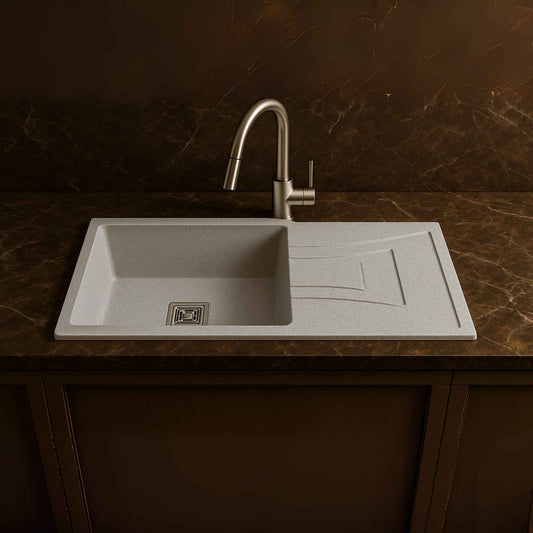 Front angle of modern matte silver kitchen sink placed in luxury kitchen