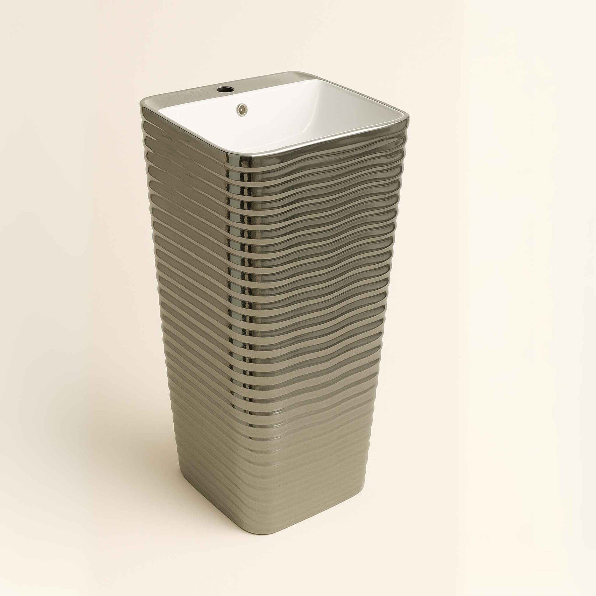 Side angle showing horizontal ripple finish on silver pedestal basin