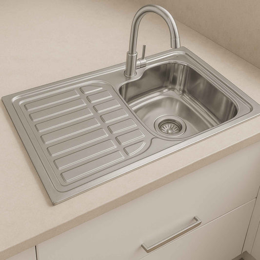 Stainless steel sink with drainboard installed in modern beige kitchen luxurious perfect for Indian homes