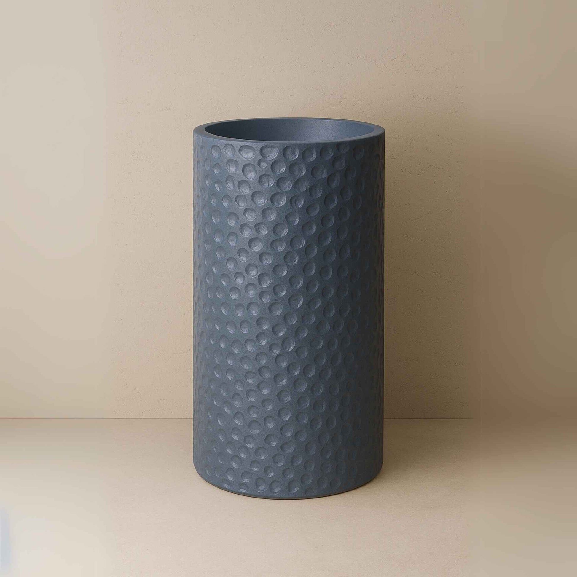 Front view of textured slate blue pedestal basin with hammered finish