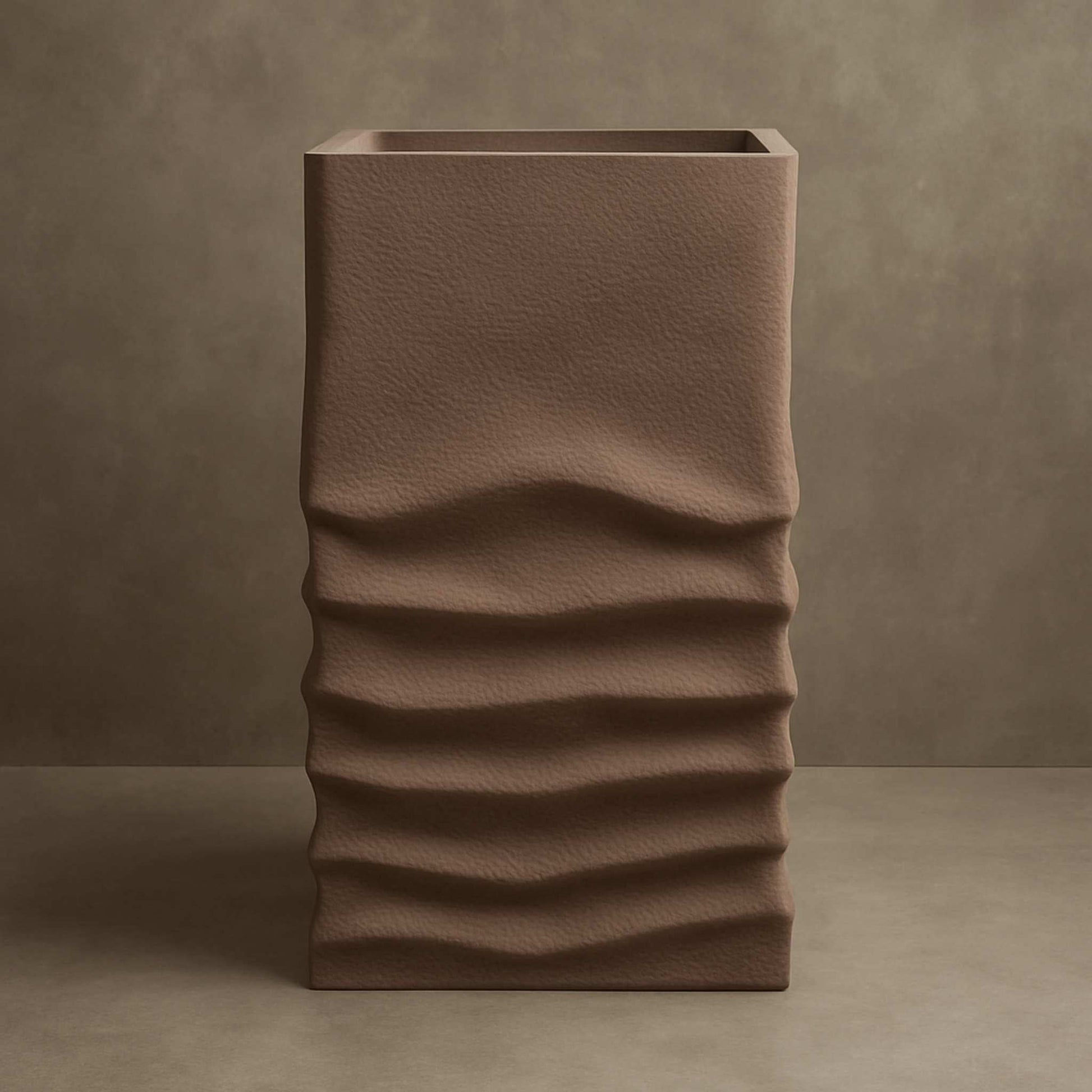 Front view of taupe pedestal basin with organic wave texture