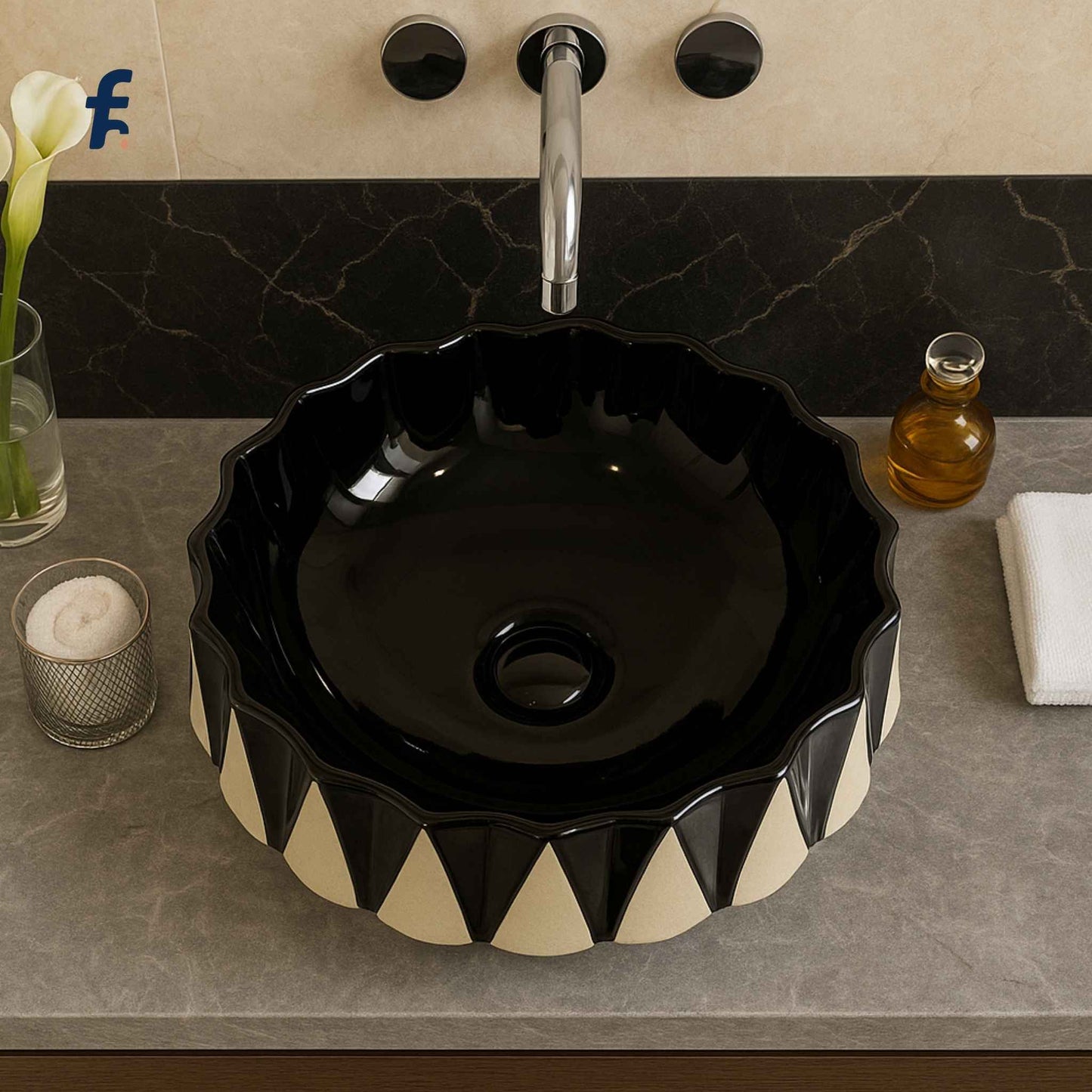 Black and white patterned sink on a bathroom counter with decorative elements.