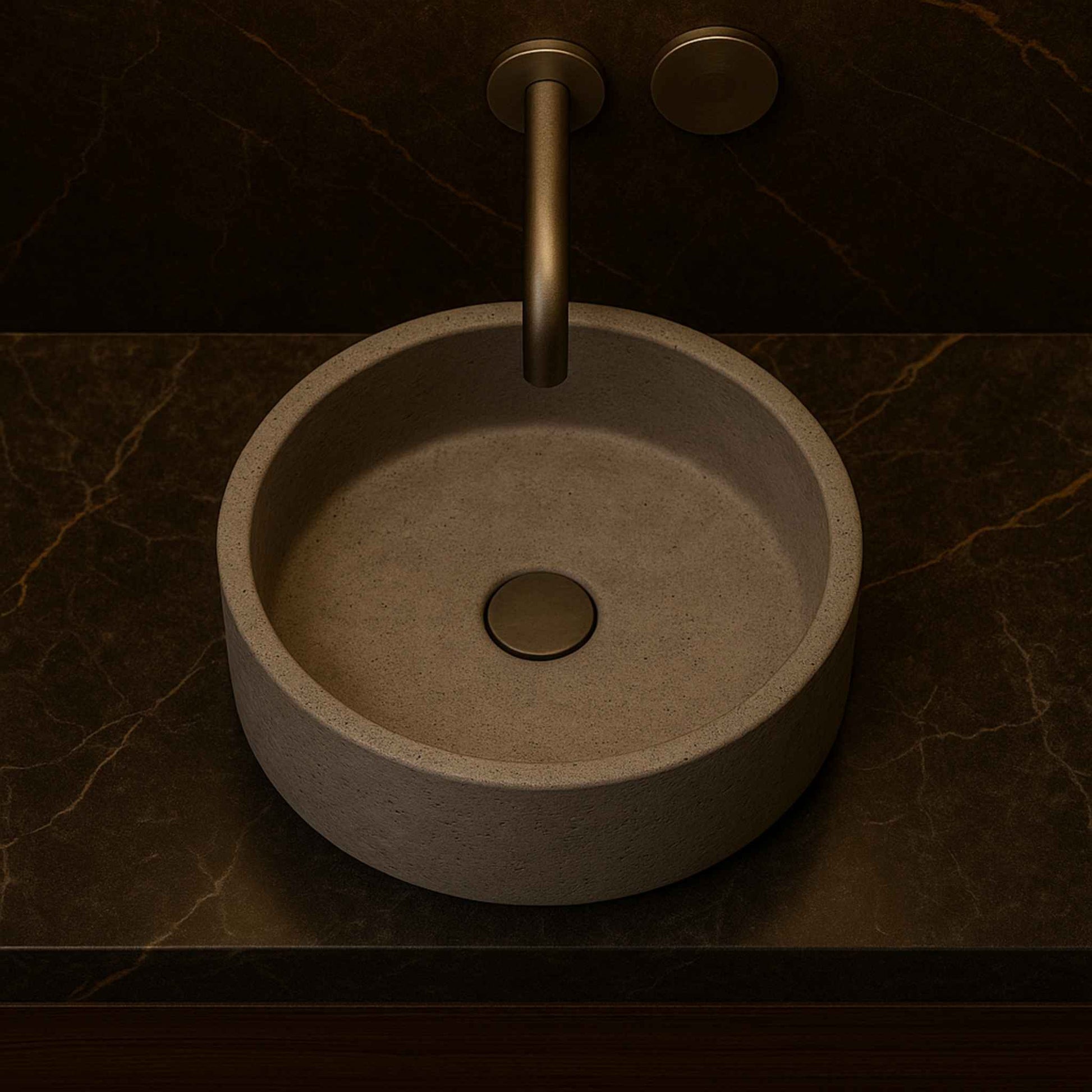 Top angle image of minimalist round grey concrete basin with wall-mounted faucet