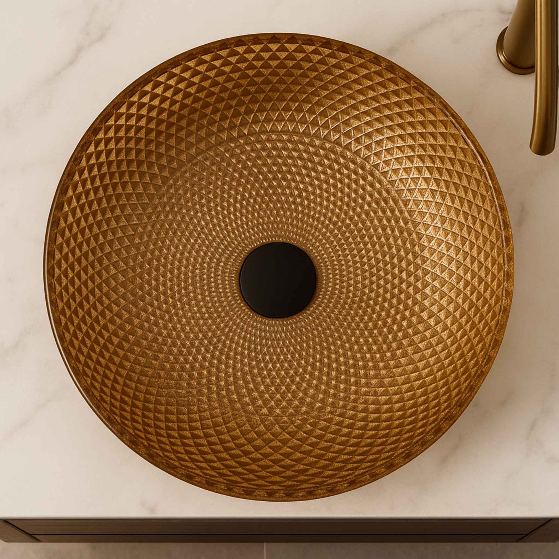 Top angle of golden diamond-pattern round glass basin on bathroom counter