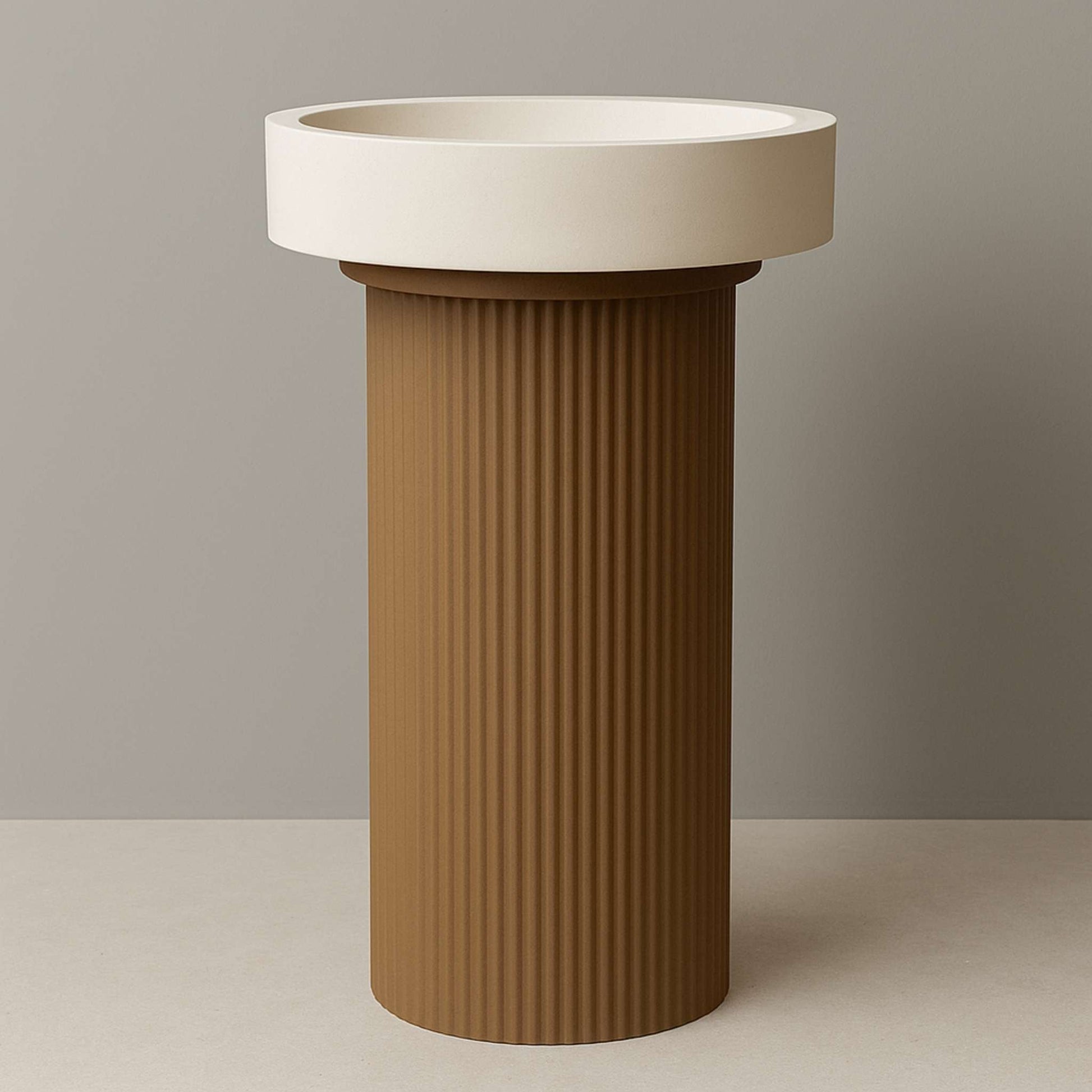 Pedestal wash basin placed in a modern bathroom with spotlight lighting