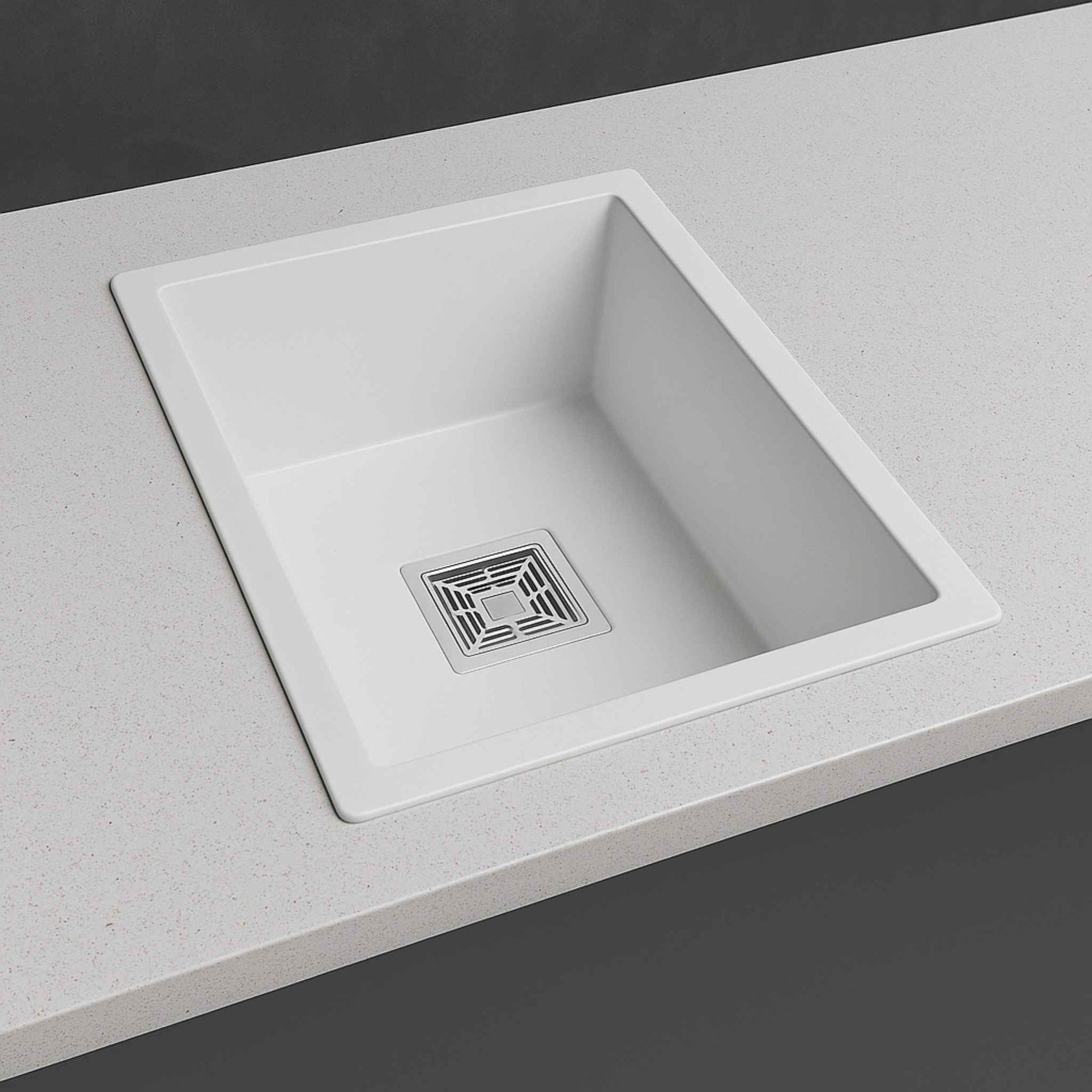 Side angle view of 18x24x9 white kitchen sink in a modern kitchen with premium marble design.
