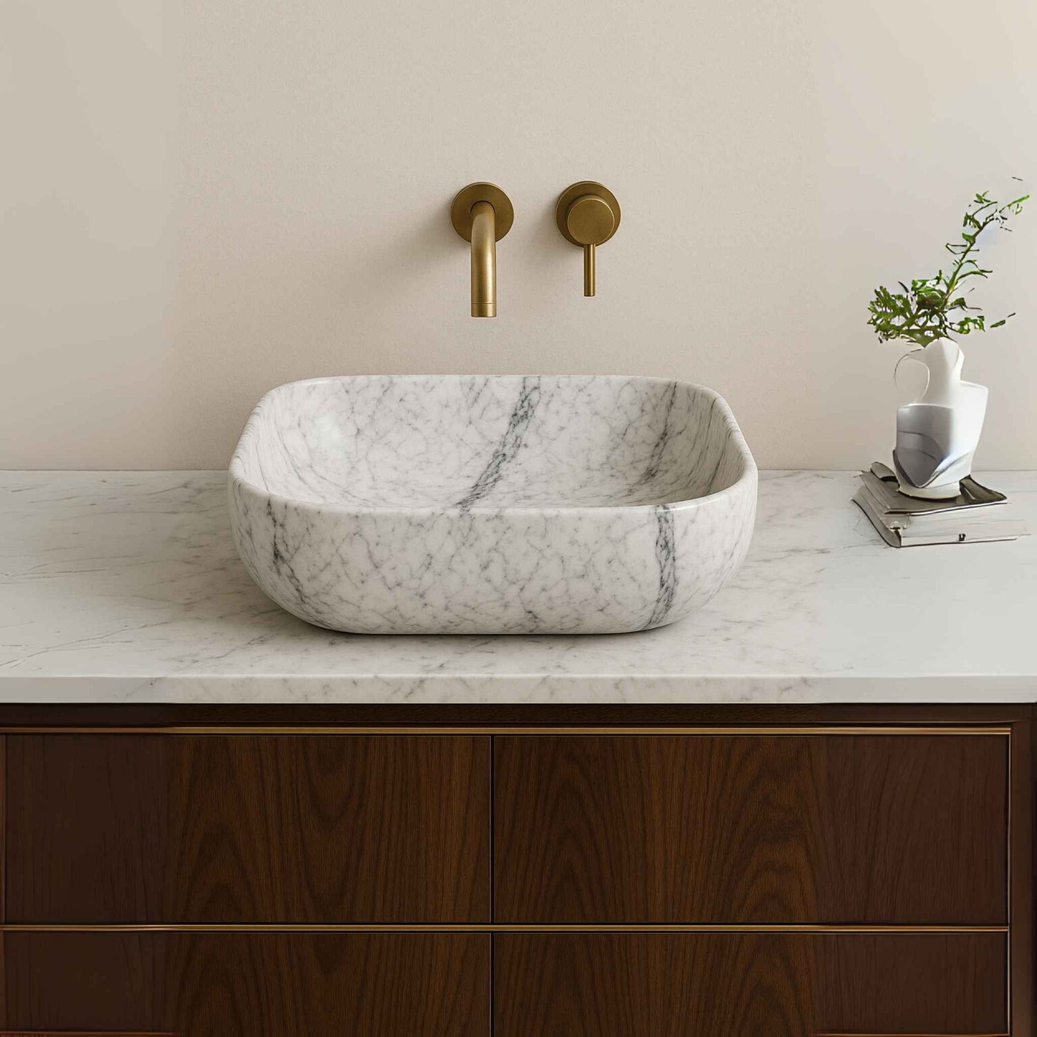 Side view of white marble bathroom sink placed on a designer vanity