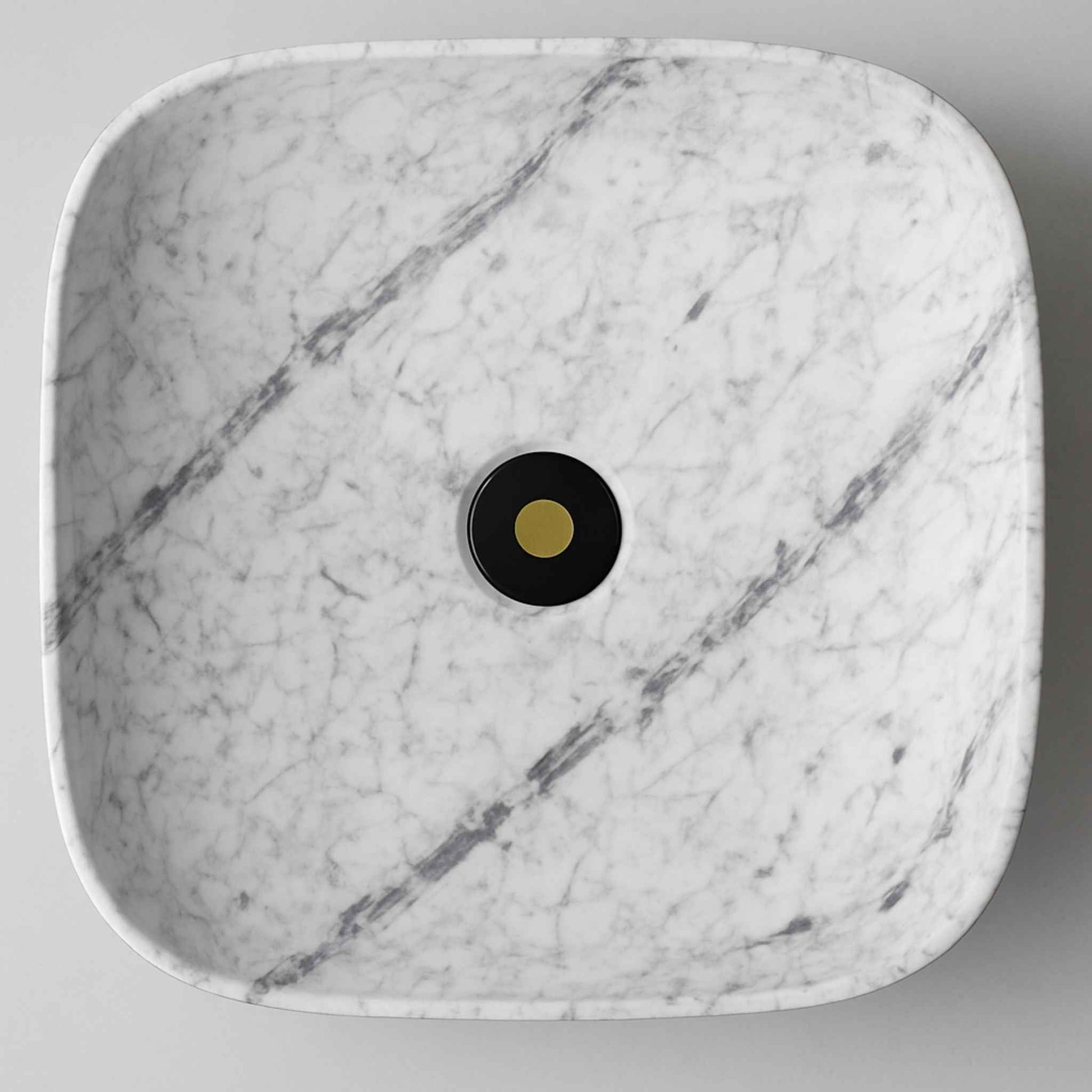 Top angle of rectangular marble wash basin with natural grey veining