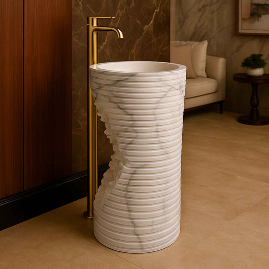 Designer bathroom with sculpted white marble basin, gold tap, and wood panel walls